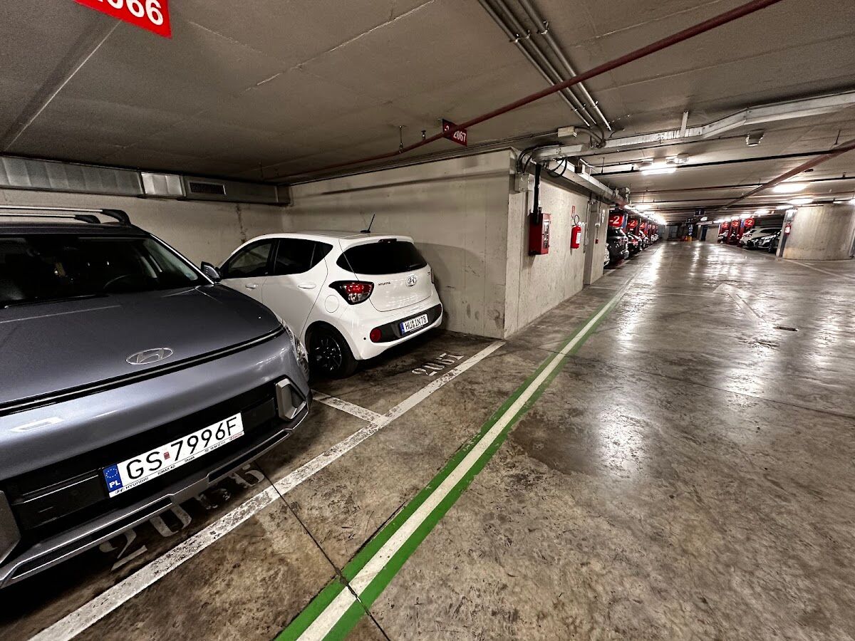 Parcheggio Beccaria: parked cars in a covered underground level with numbered bays