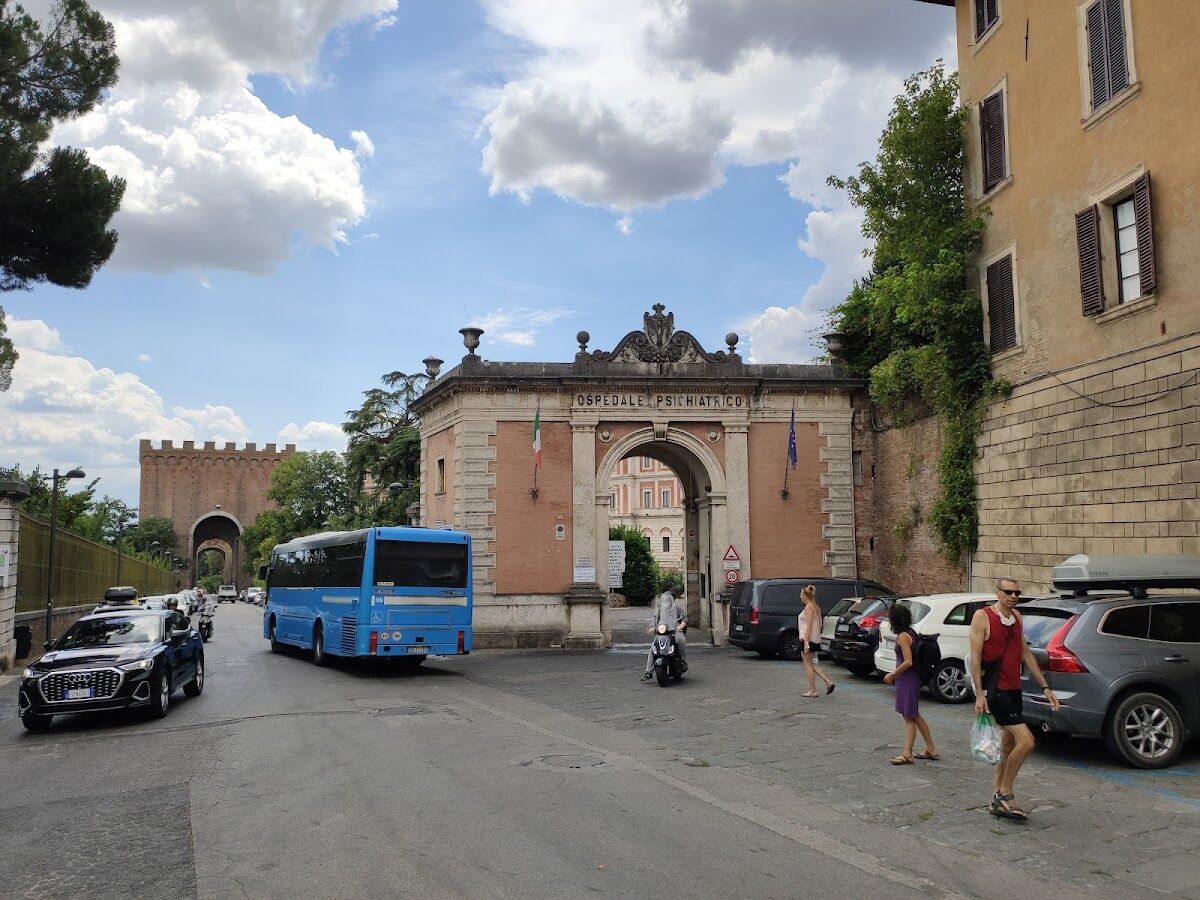 Free street parking along Via Roma on the edge of central Siena